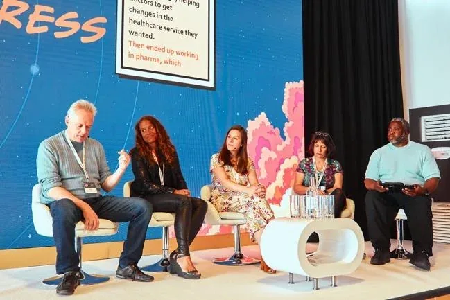 Speakers discussing AI on a panel at Adventures in Pharma