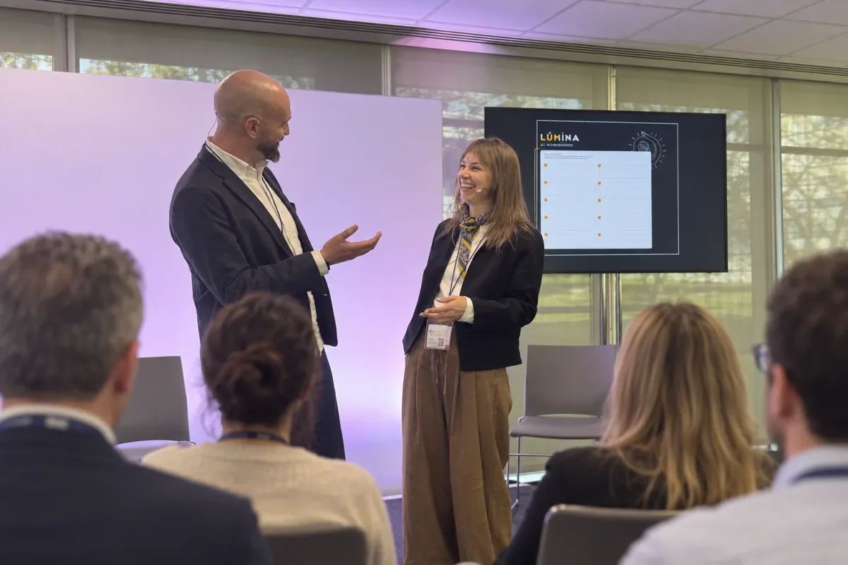 James Turnbull and a fellow presenter leading a Lúmina AI workshop in front of an audience